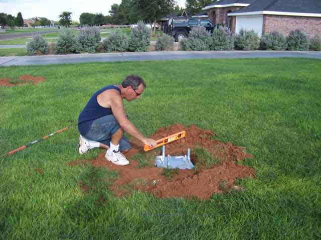 100_0044big.jpg - Hinged Base - Checking Level. After it sets, I'll unbolt until Thanksgiving.