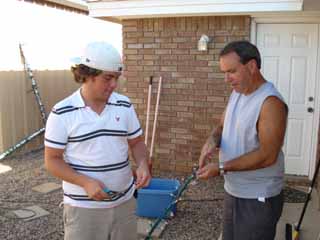 stringingsmall.jpg - Each strand in the Mega-Tree is actually a clear and multicolor string wrapped and zip-tied to a 14 gauge THHN wire.